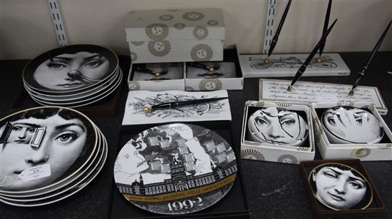 A collection of Fornasetti Temi e Variazioni and musical trophy pattern items,